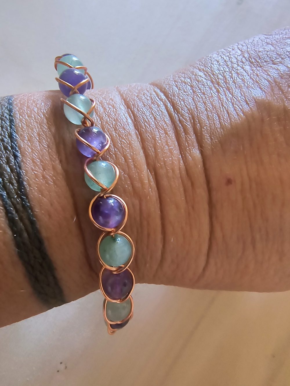 Hand Crafted Copper Wire Bracelet with Purple and Aqua Beads